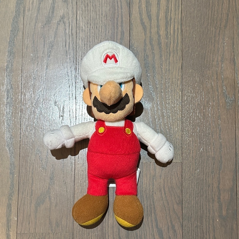Red and White Plush Character Toy